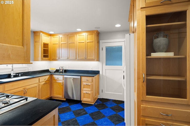 kitchen with light brown cabinetry, stovetop, sink, white refrigerator, and stainless steel dishwasher