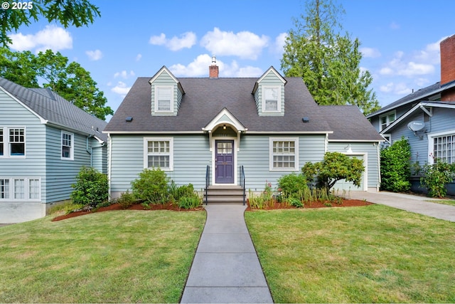 cape cod house featuring a front yard