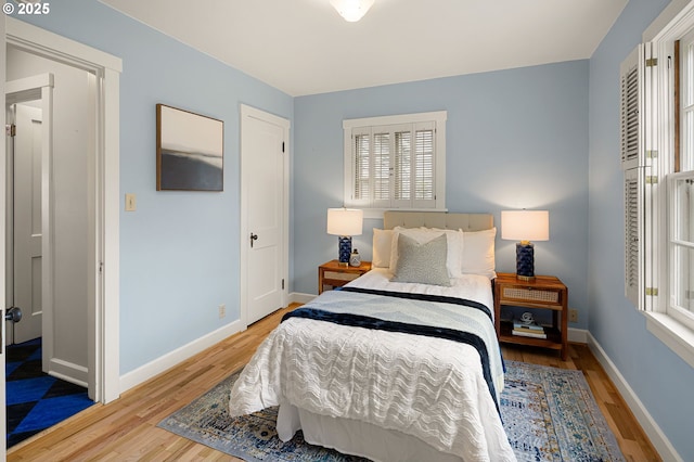 bedroom with light hardwood / wood-style floors