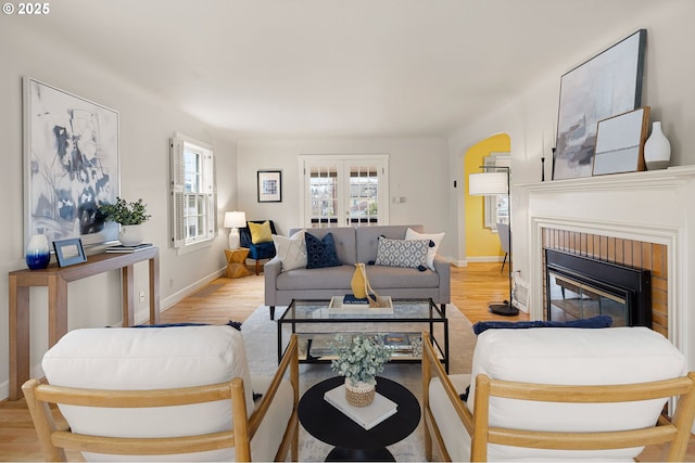 living room featuring a fireplace and light hardwood / wood-style flooring