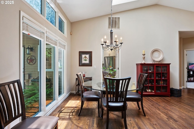 11315 NW Reeves St, Portland, OR 97229 - dining space with a chandelier, dark wood finished floors, and high vaulted ceiling