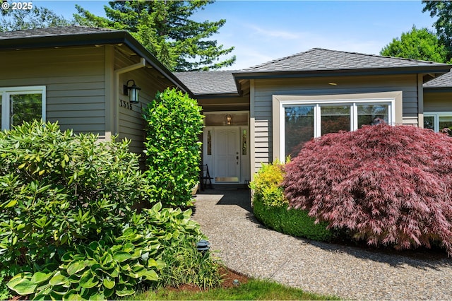 11315 NW Reeves St, Portland, OR 97229 - property entrance with a shingled roof