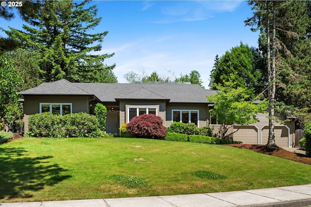 11315 NW Reeves St, Portland, OR 97229 - view of front of house with a front lawn, a garage, and a shingled roof