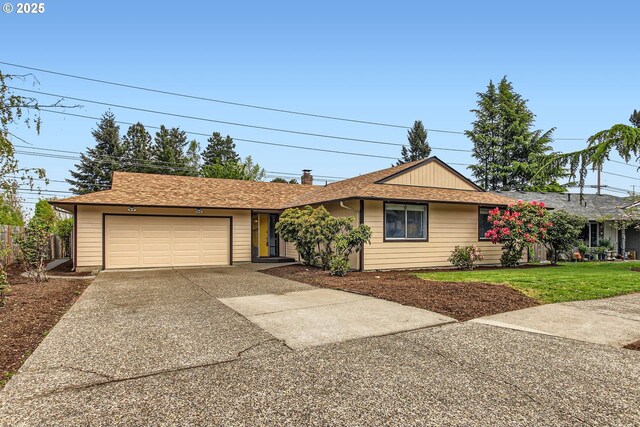 ranch-style house with driveway, a chimney, a front yard, and a garage