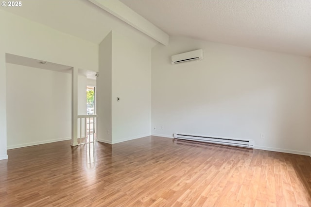 unfurnished room featuring beam ceiling, a baseboard heating unit, a wall unit AC, and wood finished floors