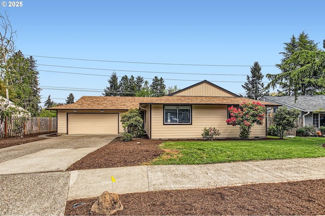 ranch-style home featuring an attached garage, a front lawn, fence, and driveway