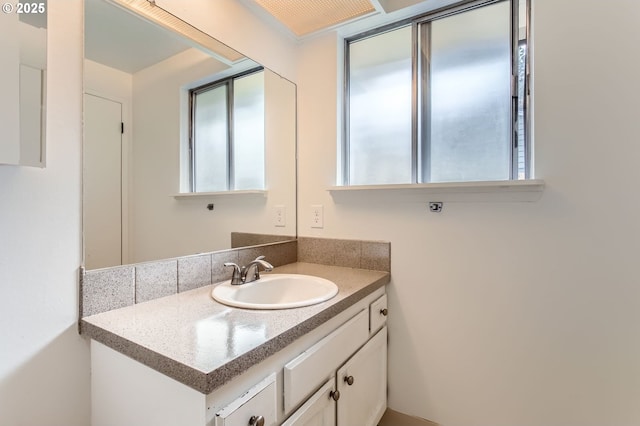 bathroom featuring a healthy amount of sunlight and vanity