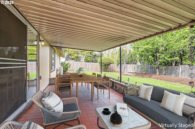 view of patio / terrace with an outdoor living space and a fenced backyard