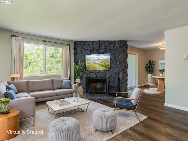 47 Eagle Crest Dr Unit 22, Lake Oswego, OR 97035 - living room with wood finished floors, baseboards, and a stone fireplace