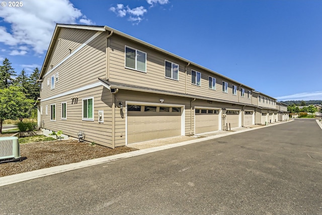 view of home's exterior with community garages