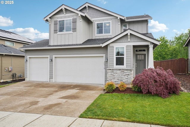 2570 SE Kane Ave, Gresham, OR 97080 - craftsman-style home featuring an attached garage, board and batten siding, driveway, stone siding, and a shingled roof