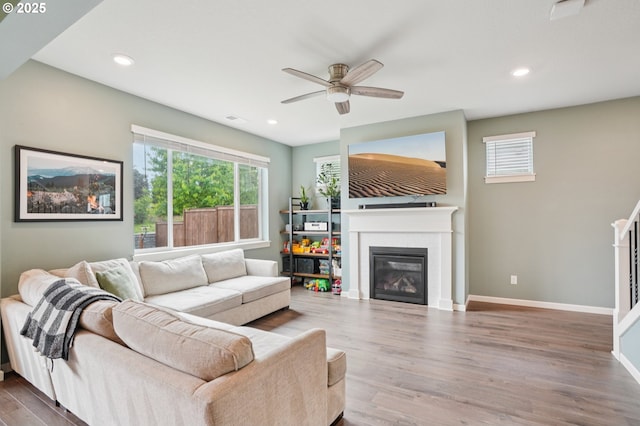 2570 SE Kane Ave, Gresham, OR 97080 - living room with ceiling fan, wood finished floors, a glass covered fireplace, baseboards, and recessed lighting