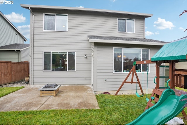 2570 SE Kane Ave, Gresham, OR 97080 - rear view of house featuring a playground, a patio area, and a fire pit