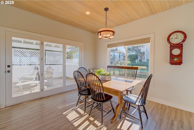 4830 Butterfly Ln, Gearhart, OR 97138 - dining space featuring healthy amount of natural light, wood ceiling, light wood-style flooring, and baseboards
