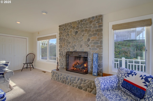 4830 Butterfly Ln, Gearhart, OR 97138 - living area with carpet, a fireplace, and baseboards