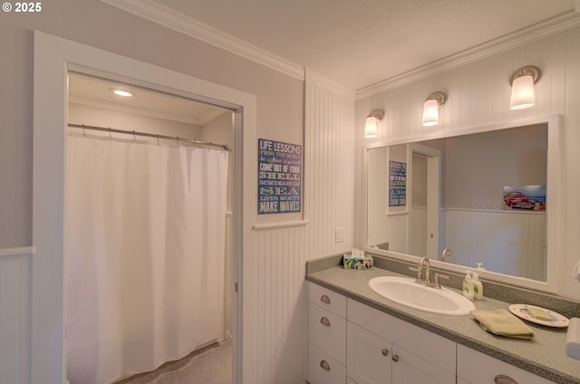 4830 Butterfly Ln, Gearhart, OR 97138 - bathroom featuring ornamental molding, vanity, a decorative wall, and curtained shower