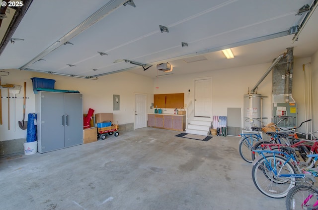 4830 Butterfly Ln, Gearhart, OR 97138 - garage featuring electric panel, secured water heater, and a garage door opener