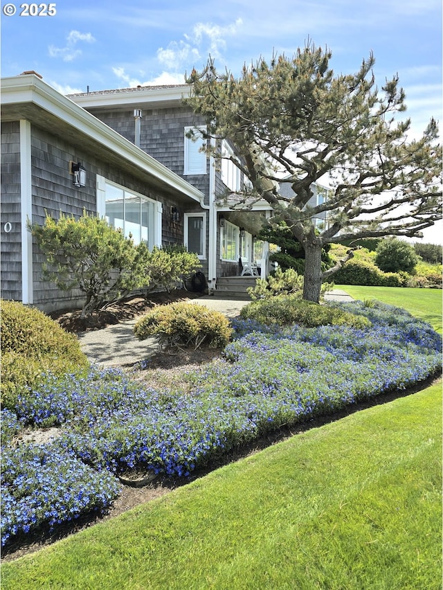 4830 Butterfly Ln, Gearhart, OR 97138 - view of side of home featuring a lawn