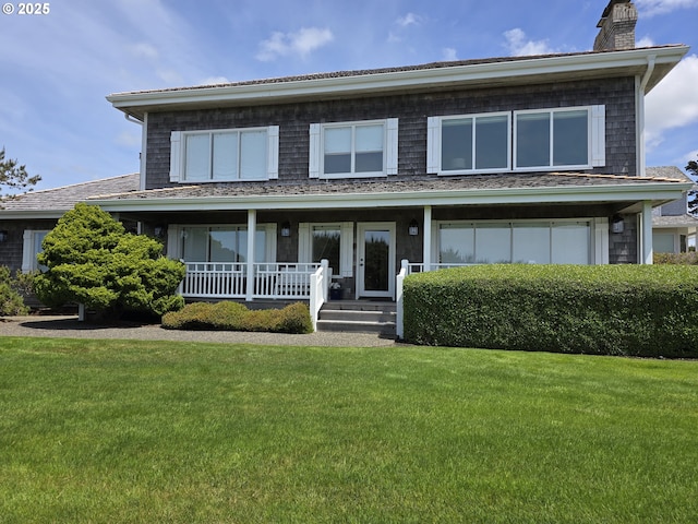 4830 Butterfly Ln, Gearhart, OR 97138 - view of front of property with a chimney, a front lawn, and a porch