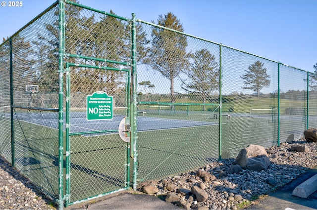 4830 Butterfly Ln, Gearhart, OR 97138 - view of tennis court with a gate
