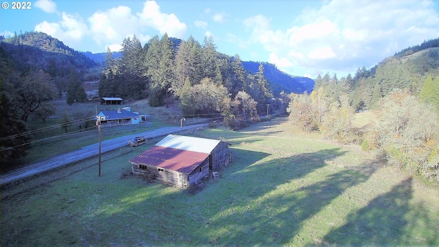 birds eye view of property with a mountain view