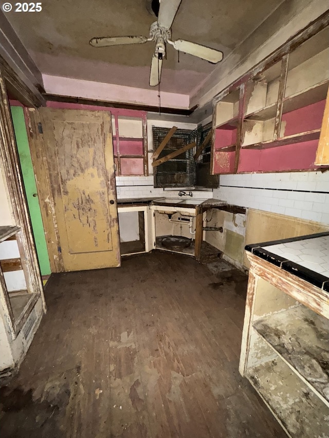 misc room with ceiling fan and dark hardwood / wood-style flooring