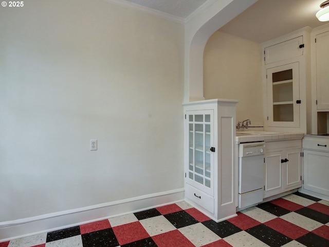 20 NW 16th Ave Unit 211, Portland, OR 97209 - kitchen with dishwasher, light floors, a sink, tile countertops, and white cabinets