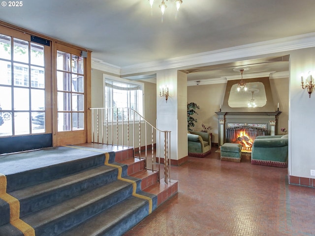 20 NW 16th Ave Unit 211, Portland, OR 97209 - staircase with ornamental molding, baseboards, and a warm lit fireplace