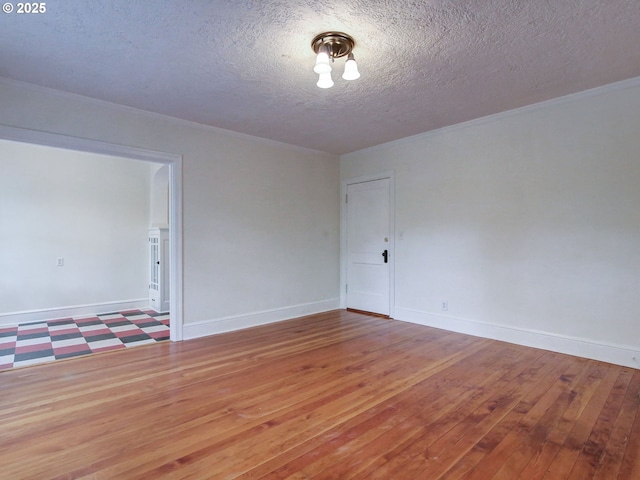 20 NW 16th Ave Unit 211, Portland, OR 97209 - empty room with a textured ceiling, wood-type flooring, and baseboards