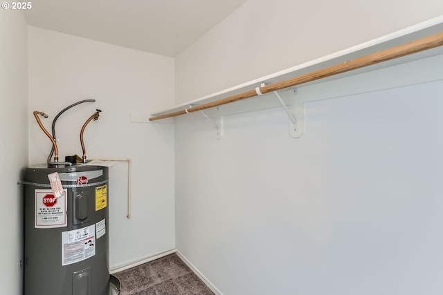 utility room featuring electric water heater