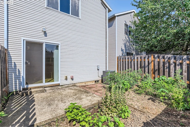 view of property exterior with a patio area and central air condition unit