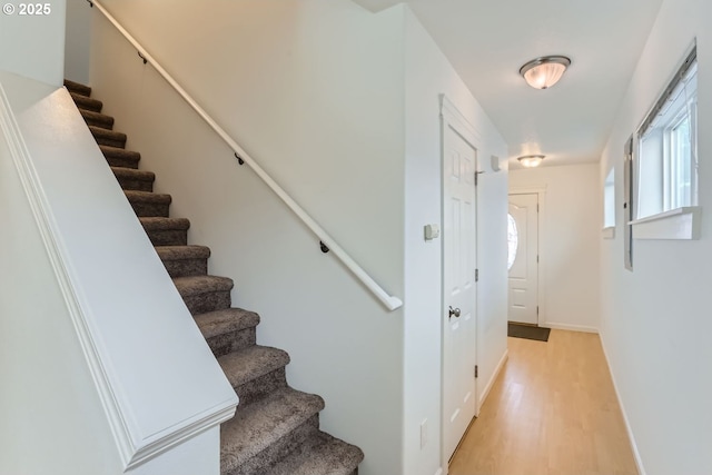 stairway featuring hardwood / wood-style flooring