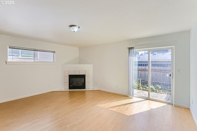 unfurnished living room featuring a fireplace and light wood-type flooring