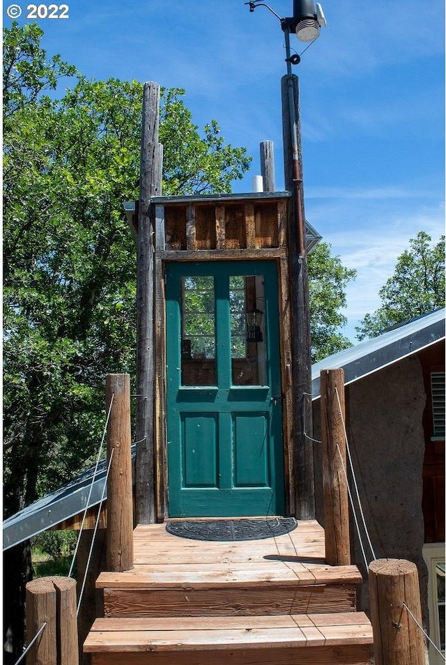 entrance to property with a deck