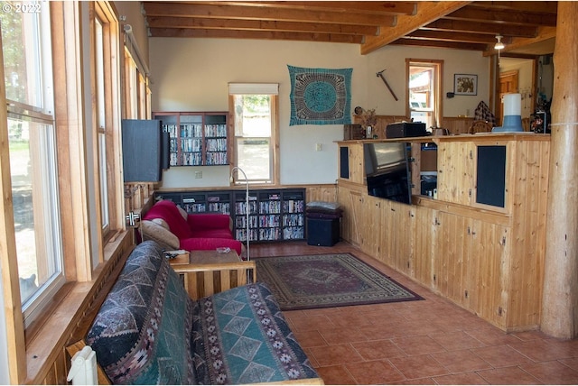 tiled living room featuring beam ceiling