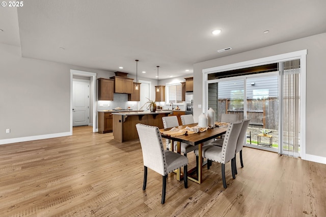 5719 N 87th Ave, Camas, WA 98607 - dining area featuring baseboards, light wood finished floors, and recessed lighting