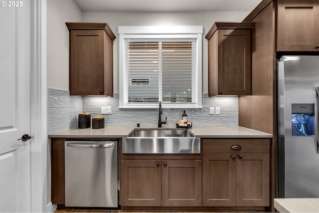 5719 N 87th Ave, Camas, WA 98607 - kitchen featuring appliances with stainless steel finishes, a sink, backsplash, and light countertops