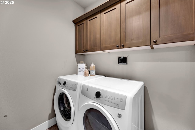 5719 N 87th Ave, Camas, WA 98607 - laundry area featuring cabinet space, washing machine and dryer, and baseboards