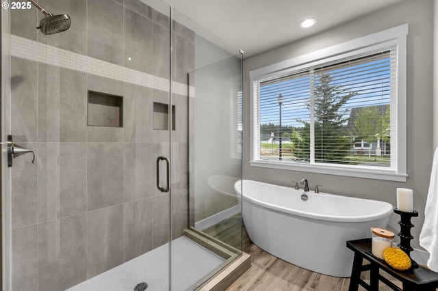 5719 N 87th Ave, Camas, WA 98607 - bathroom featuring a freestanding tub, a shower stall, and wood finished floors