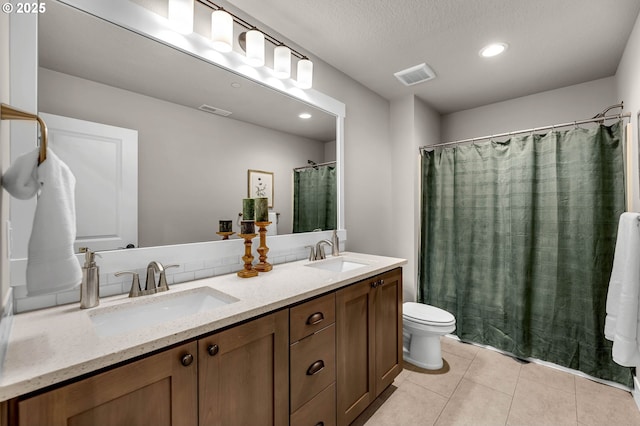 5719 N 87th Ave, Camas, WA 98607 - full bathroom featuring toilet, tile patterned flooring, double vanity, recessed lighting, and a shower with curtain