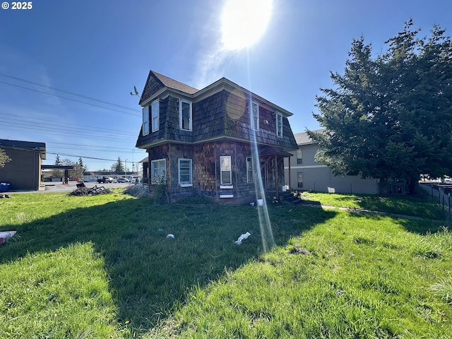 214 W Broadway St, Goldendale, WA 98620 - view of side of home featuring stone siding and a lawn