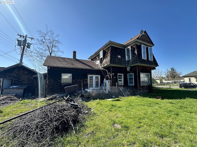 214 W Broadway St, Goldendale, WA 98620 - rear view of property featuring a yard and a chimney