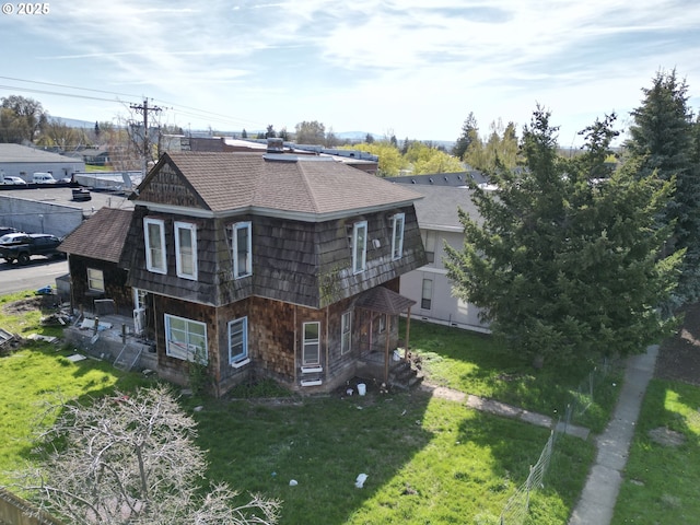 214 W Broadway St, Goldendale, WA 98620 - exterior space with roof with shingles and a lawn