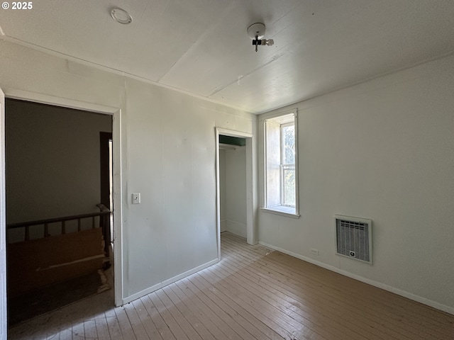 214 W Broadway St, Goldendale, WA 98620 - unfurnished bedroom with hardwood / wood-style floors, a closet, baseboards, and visible vents
