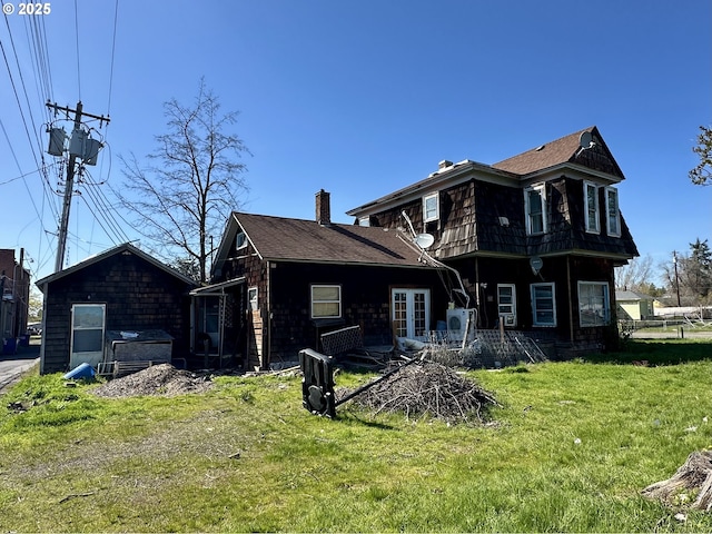 214 W Broadway St, Goldendale, WA 98620 - back of property with a chimney and a lawn