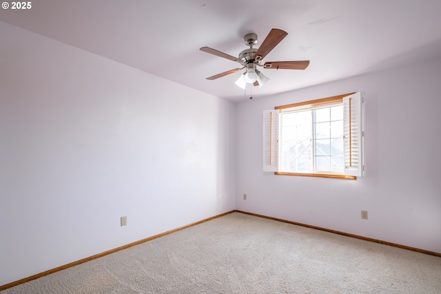 spare room with ceiling fan and carpet floors