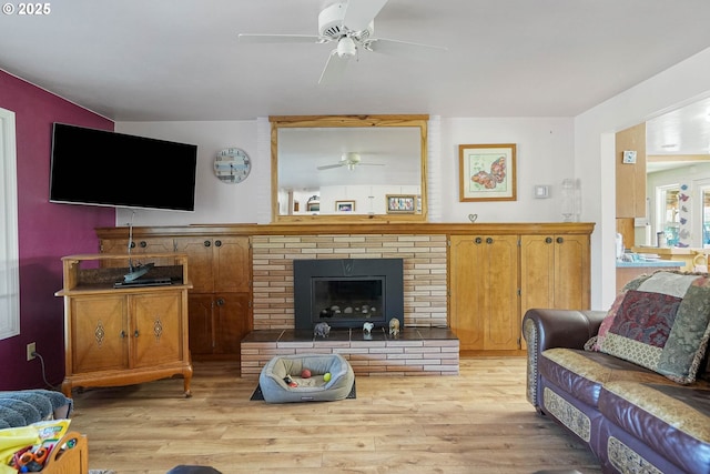 41108/41100 Oupor Dr, Scio, OR 97374 - living area with a ceiling fan, light wood-style floors, and a brick fireplace