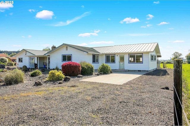 41108/41100 Oupor Dr, Scio, OR 97374 - ranch-style house with metal roof, a chimney, a patio area, and a standing seam roof