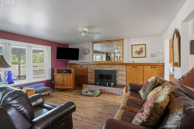 41108/41100 Oupor Dr, Scio, OR 97374 - living room with a ceiling fan, wood finished floors, and a brick fireplace