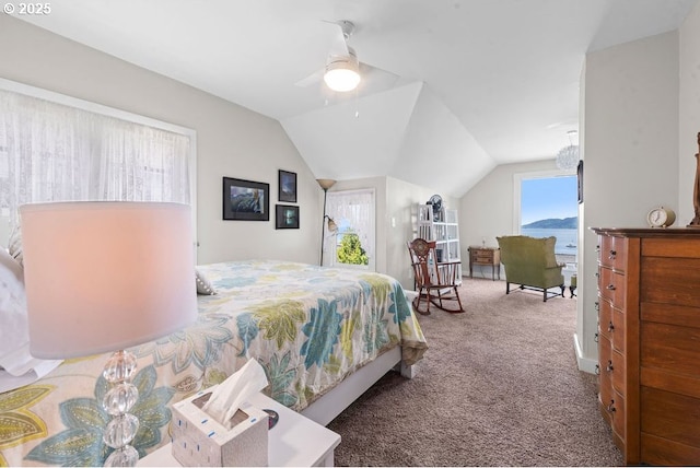 carpeted bedroom featuring vaulted ceiling and ceiling fan